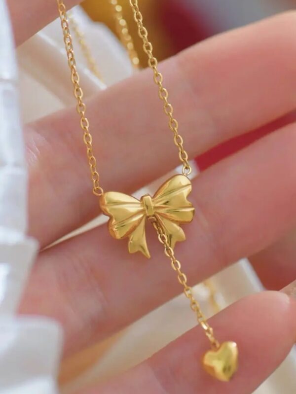 Bow necklace with a heart tassel - Image 2