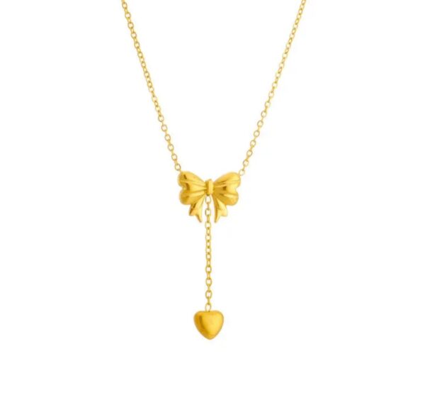 Bow necklace with a heart tassel